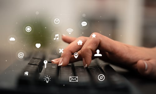 Business woman hand typing on keyboard with application icons around Business woman hand typing on keyboard with application icons around